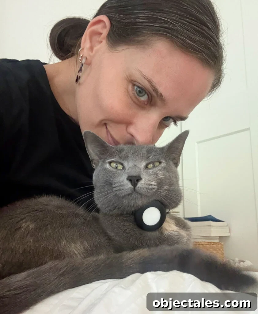 Sherry putting face on head of cat