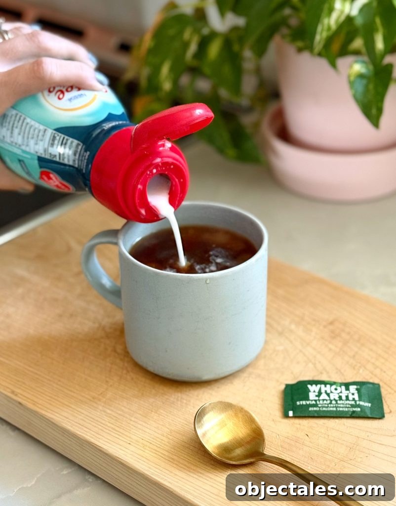 Adding Coconut Creamer To Mug of Pour Over Coffee