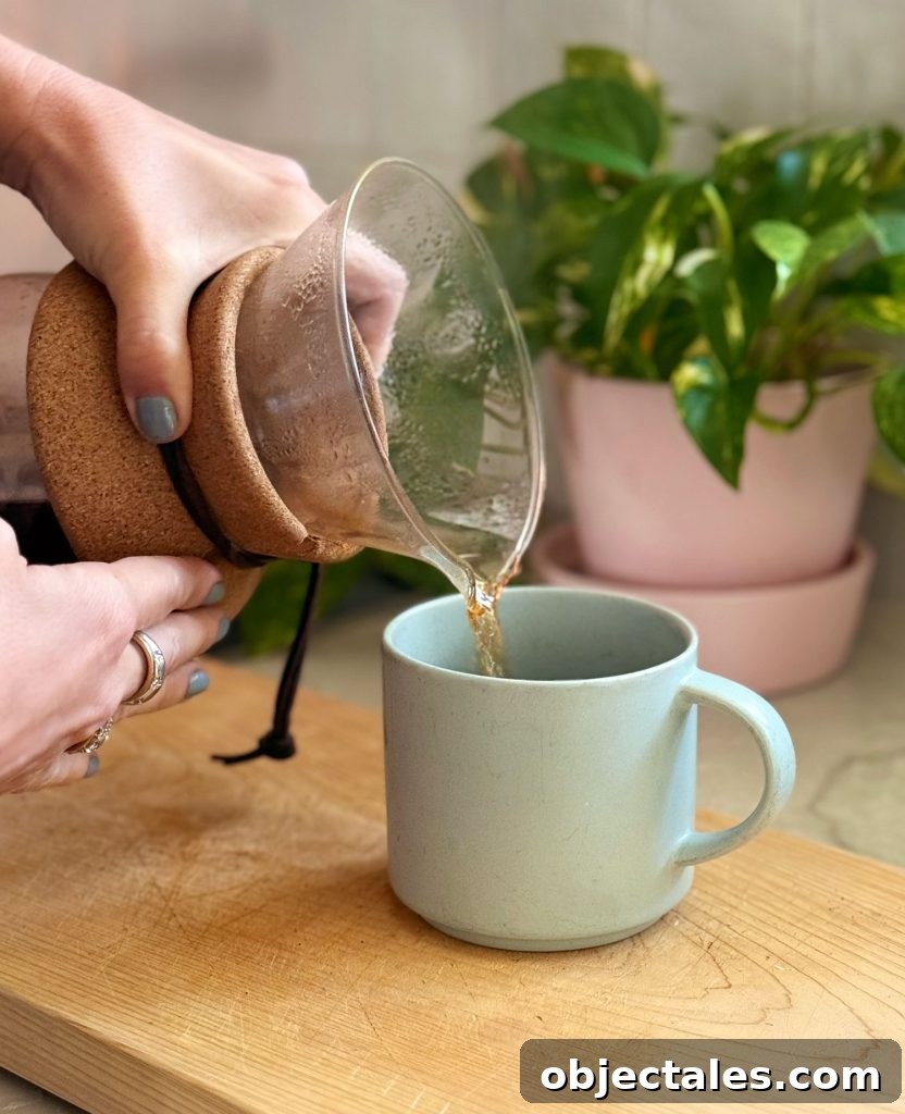Make Smooth Cold Brew Coffee at Home 12 Pouring Pour Over Coffee Into Mug