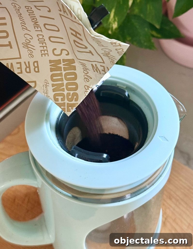 Make Smooth Cold Brew Coffee at Home 7 Adding Ground Coffee To Filter Of Cold Brew Maker