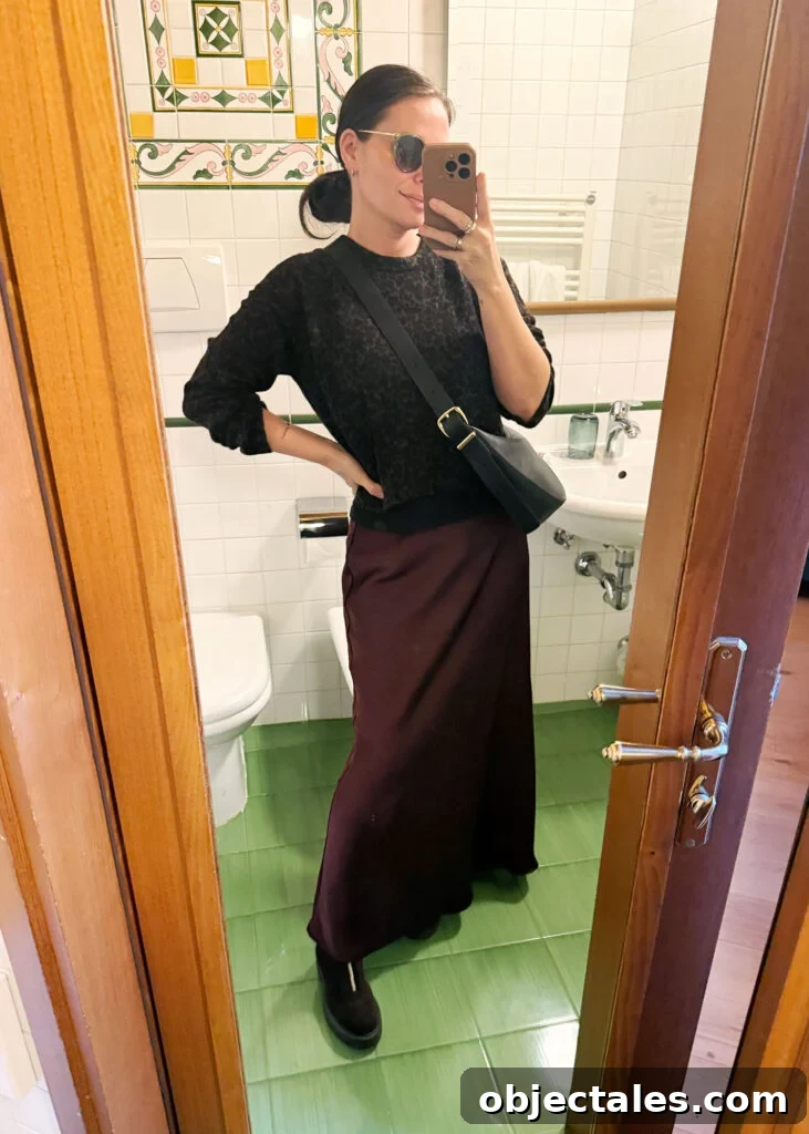 How I Packed One Carry-On for Two Weeks in Italy 10 Sherry Selfie In Hotel Mirror In Florence Italy With Wine Skirt And Leopard Sweater