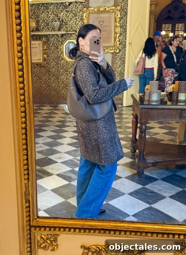 How I Packed One Carry-On for Two Weeks in Italy 14 Sherry Selfie In Mirror With Leopard Coat And Jeans In Florence Italty