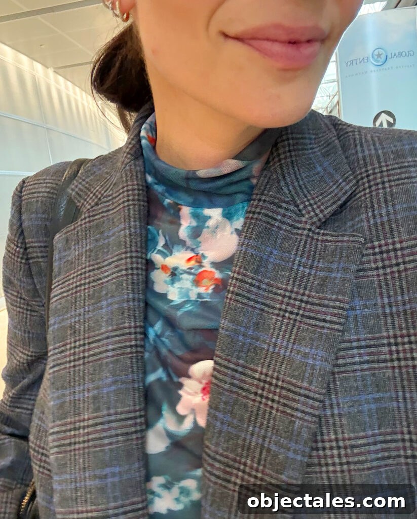 Close Up Of Floral Mesh Shirt Under Tweed Blazer