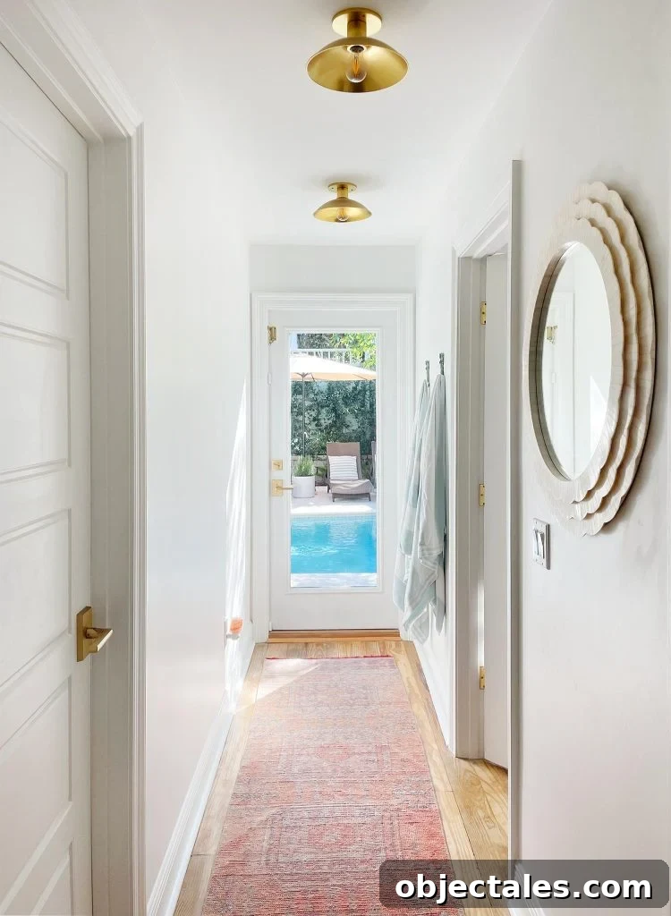 Renovating Our Home After Five Years 9 Hallway With Traditional Rug Leading To Pool