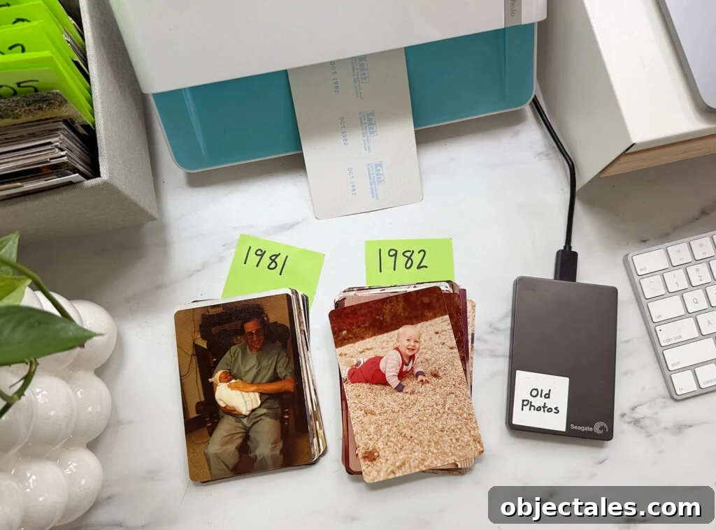 How We Organize Our Digitized Photo Library 2 Piles Of Old Photos For Scanning