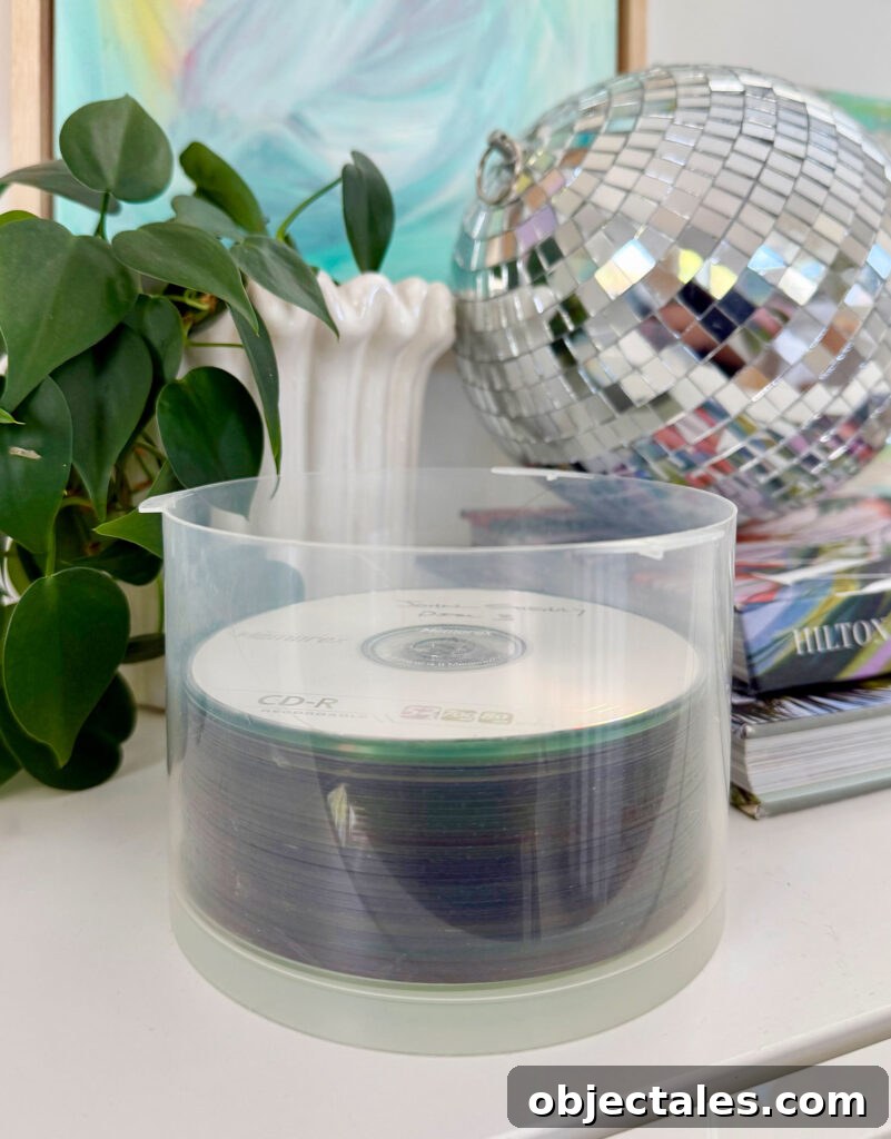 Stack of burned CDs containing old photos