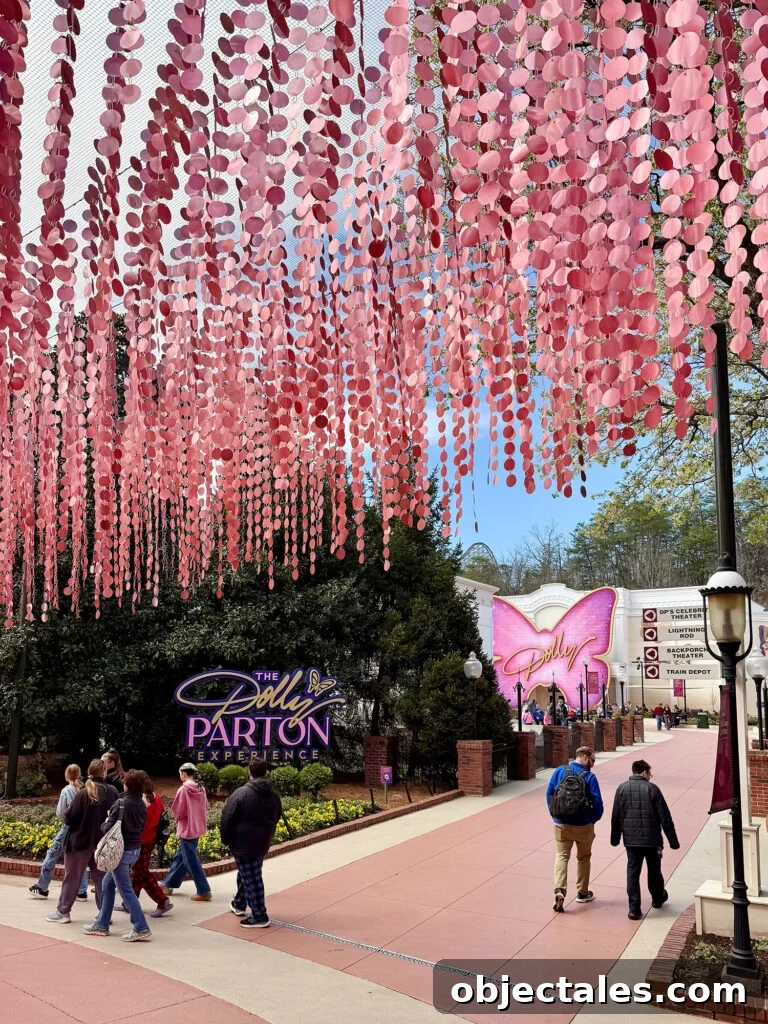 7 Can't-Miss Experiences in Pigeon Forge and Gatlinburg 5 Dollywood Theme Park With Pink Art Installation Overhead