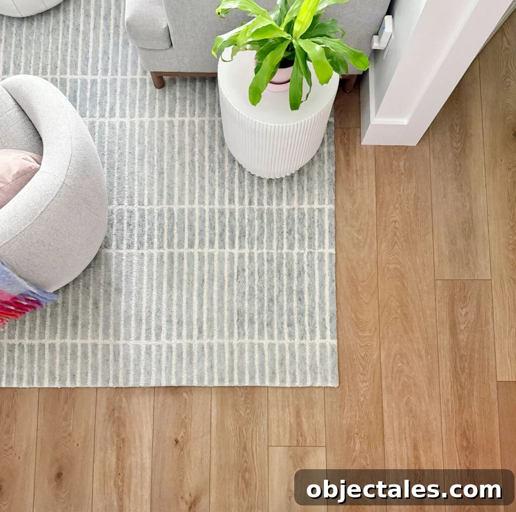 New Flooring FAQs: Answers About Installation, Care & Warranties 7 New LVP Floors Overhead With Blue Rug