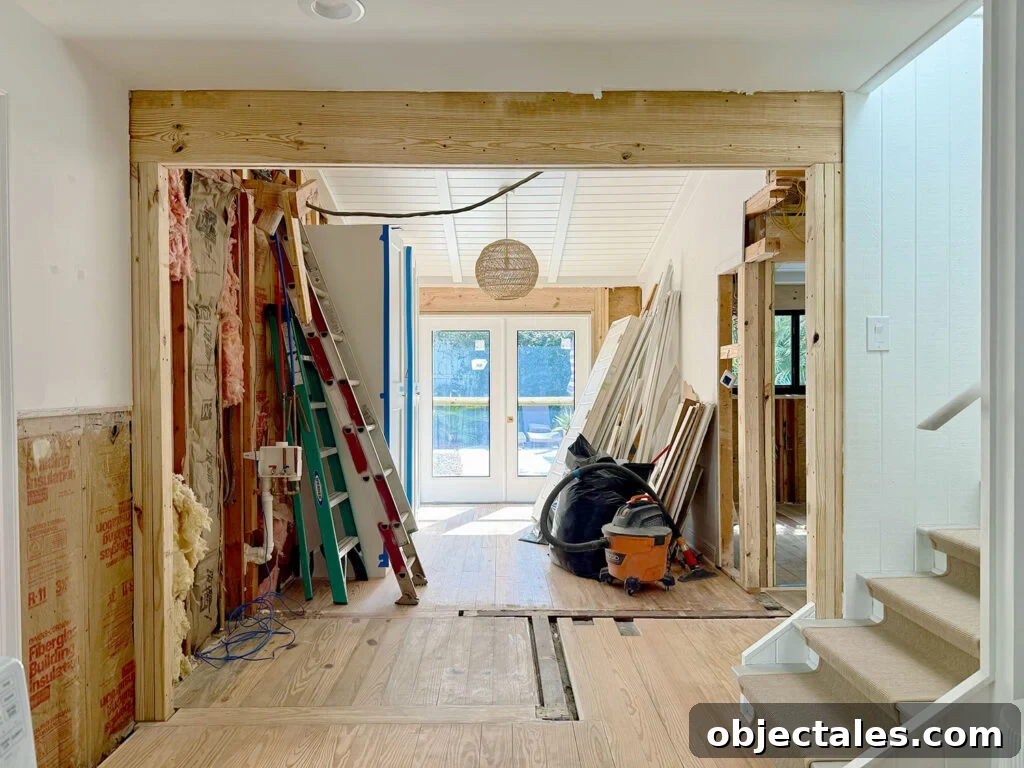New Flooring FAQs: Answers About Installation, Care & Warranties 3 View Of Opened Wall To French Doors During Renovation