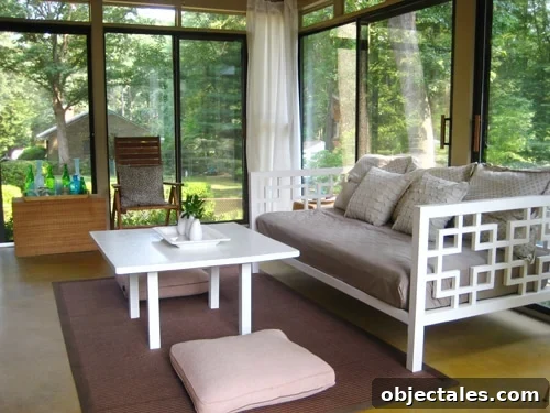 sunroomaftersmall glass doored sunroom with golden yellow stained concrete floors and white daybed and coffee table