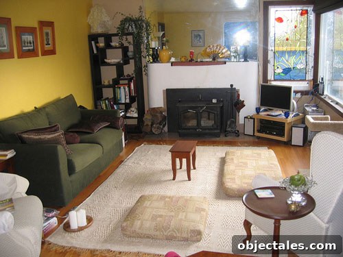 Before: curved concrete fireplace mantel and large frameless mirror