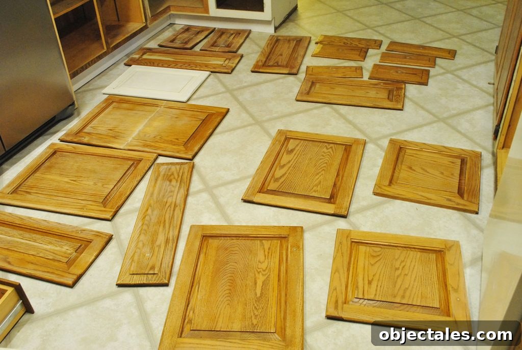 Cabinet Doors Spread Out On Kitchen Floor For Painting