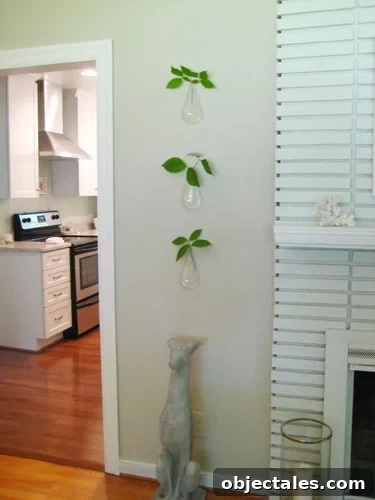 Three floating vases with tulips in a small bathroom