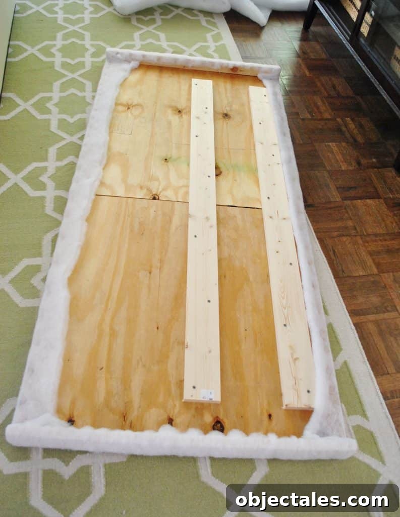 Finished batting stapled to back of DIY headboard frame