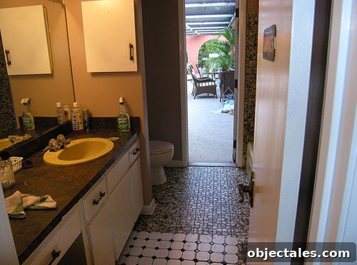Bathroom before remodel showing dated fixtures and harvest-gold tub
