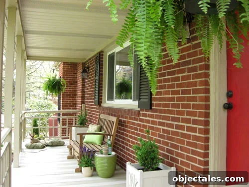 What We'd Do Differently in Our First Home: Lessons Learned 11 Brick Ranch Front Porch With Red Door and Ferns
