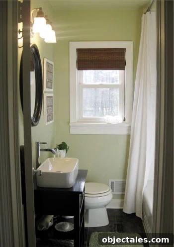 What We'd Do Differently in Our First Home: Lessons Learned 4 Green Bathroom With Dark Tile Floors And DIY Vanity