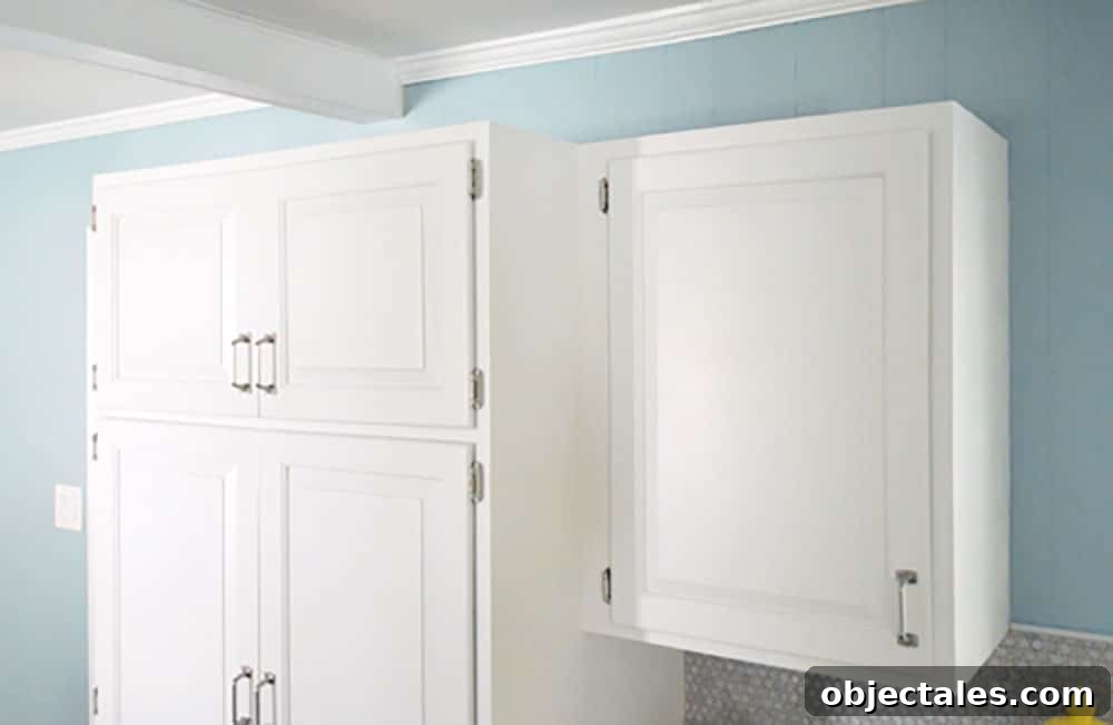 Install Crown Molding on Cabinets: DIY Step by Step Guide 5 Top of white cabinets before crown molding is added