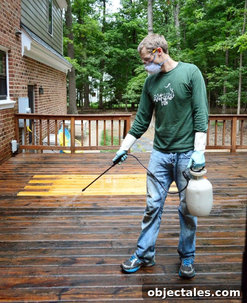 How to Strip a Deck for Staining: Remove Old Finish 14 John using pump sprayer to apply deck cleaner brightener