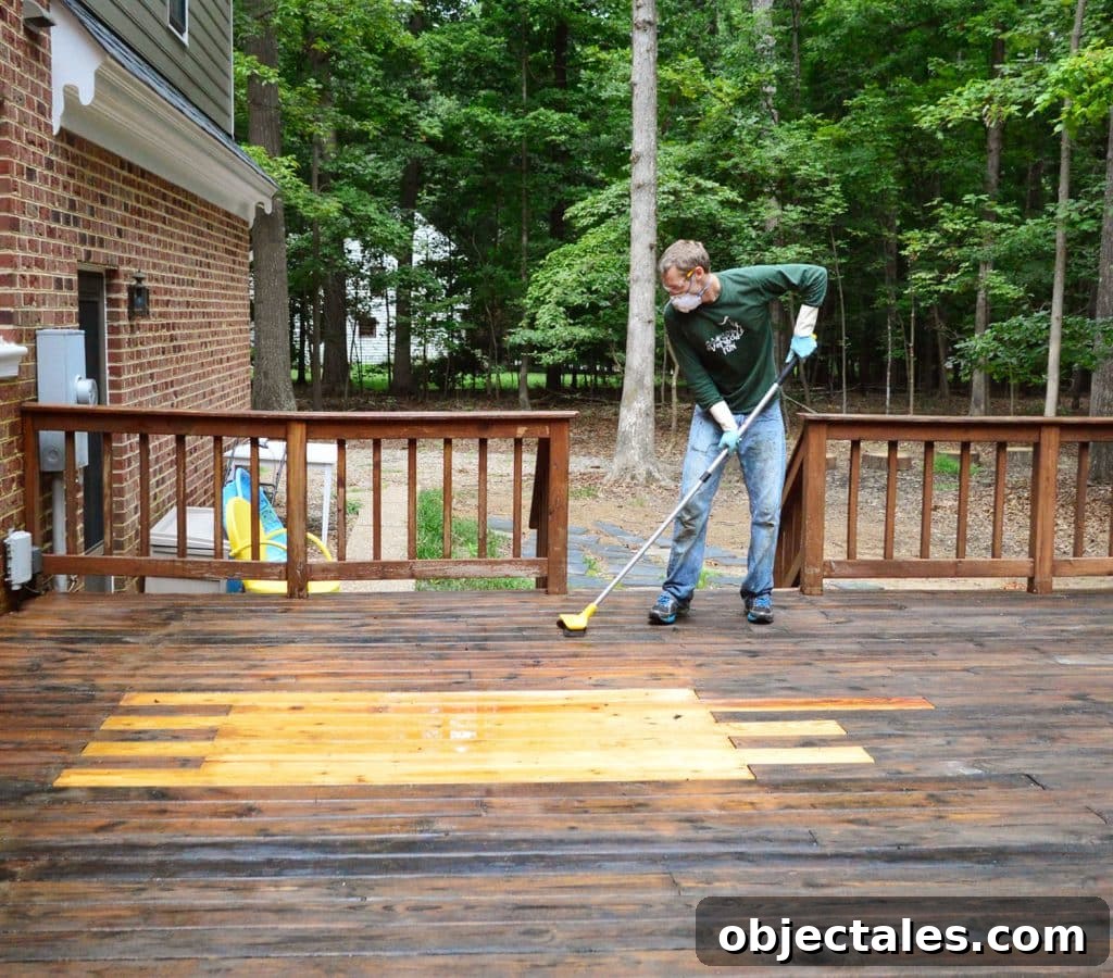 How to Strip a Deck for Staining: Remove Old Finish 15 John scrubbing wood deck with deck brightener cleaner