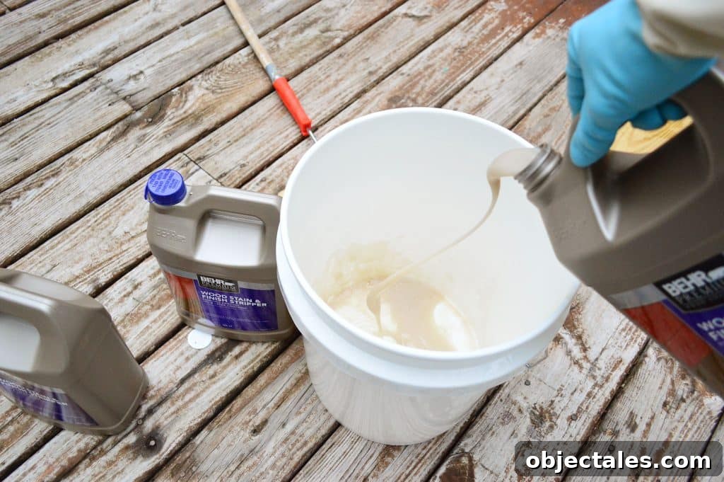 How to Strip a Deck for Staining: Remove Old Finish 8 Pouring deck stripper into a bucket