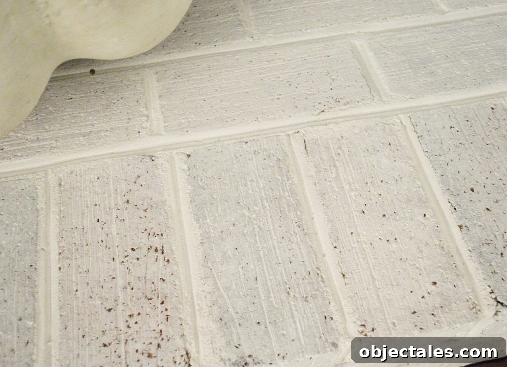 Detail of whitewash brick hearth fireplace