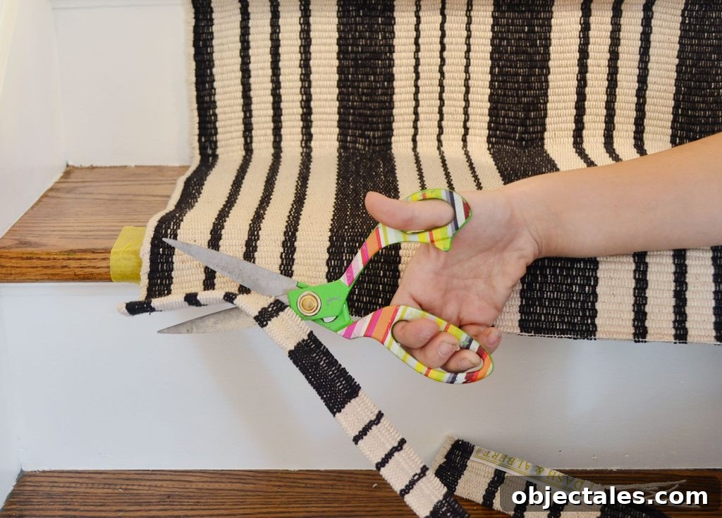 Using scissors to trim off excess runner 