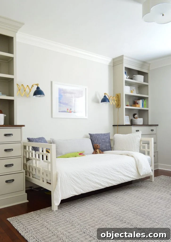 Boys bedroom with built-in bookshelves on either side of the bed,