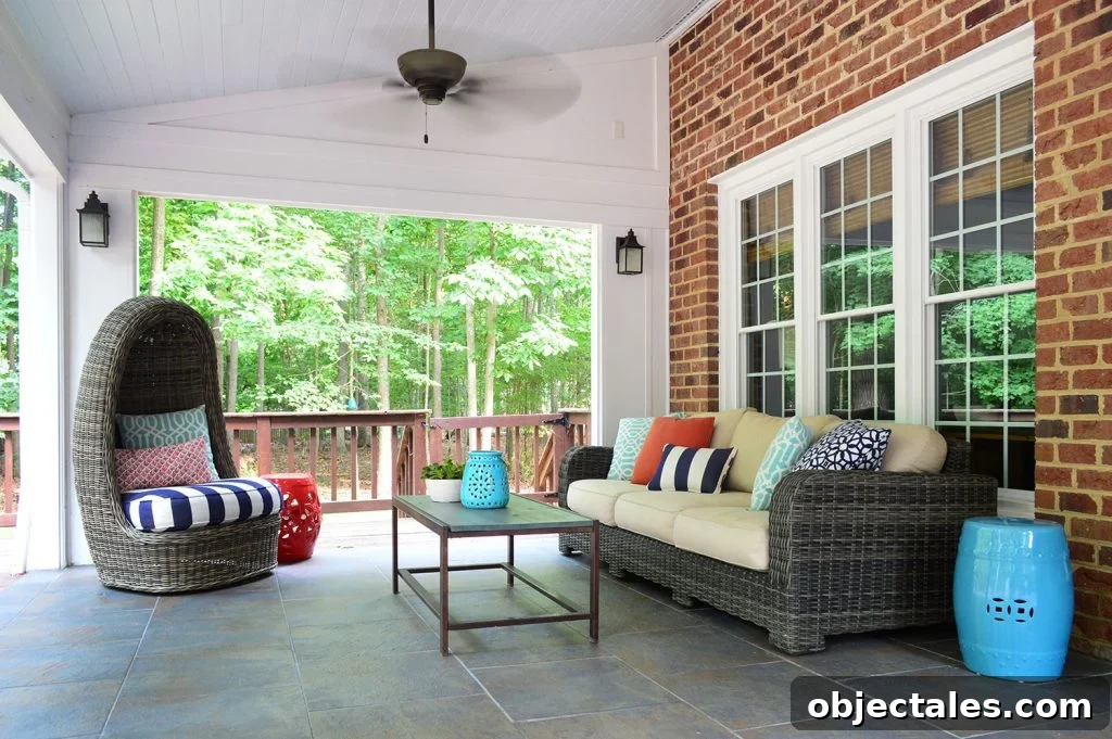 Covered sunroom patio with stained deck gate in background