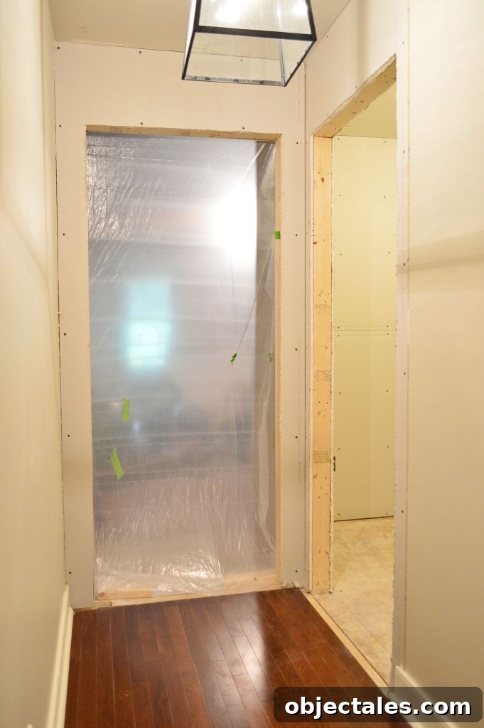 Hang Drywall Alone: Step-by-Step DIY Guide for One Person 13 two doorways drywalled and openings cut