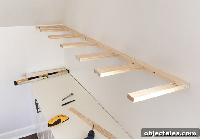 Brace piece of DIY thin wood floating shelves hung on a wall using 1x3 and 1x2 pine boards