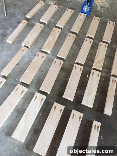 Floating shelf supports made from 1x3 pine boards cut to the same length and drilled with pocket holes using a Kreg Jig