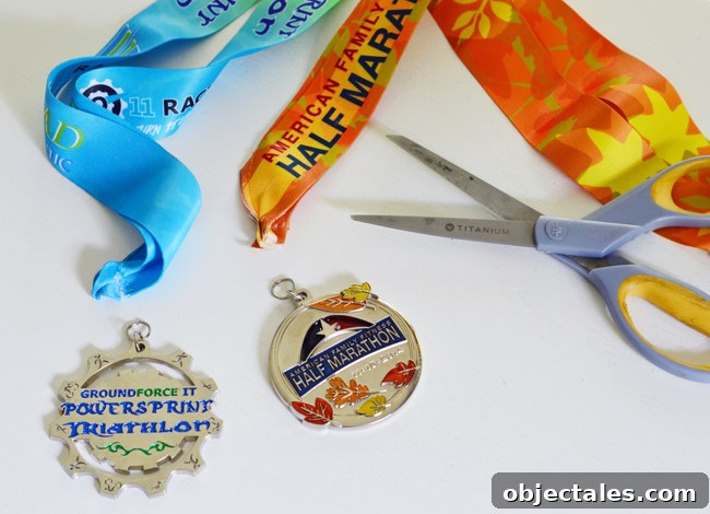 cutting ribbons off of race medals to attach ornament ribbon