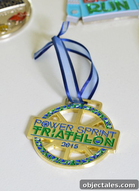 triathlon race medal with shorter ribbon to be hung on christmas tree