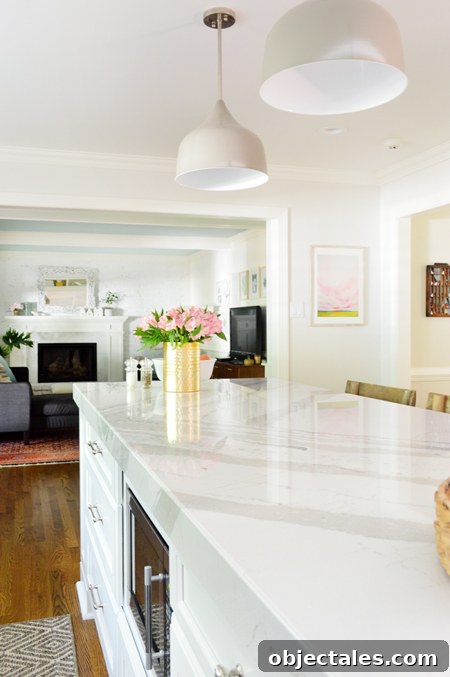 Kitchen Remodel Complete: Before and After Photos 11 white-kitchen-remodel-final-counters-with-pendants