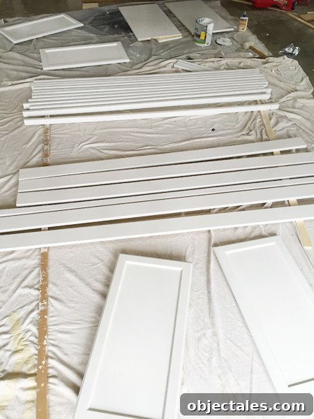 Build Custom Built-In Bookshelves: A Step-by-Step Guide 15 Painted wood pieces drying for bookshelf project