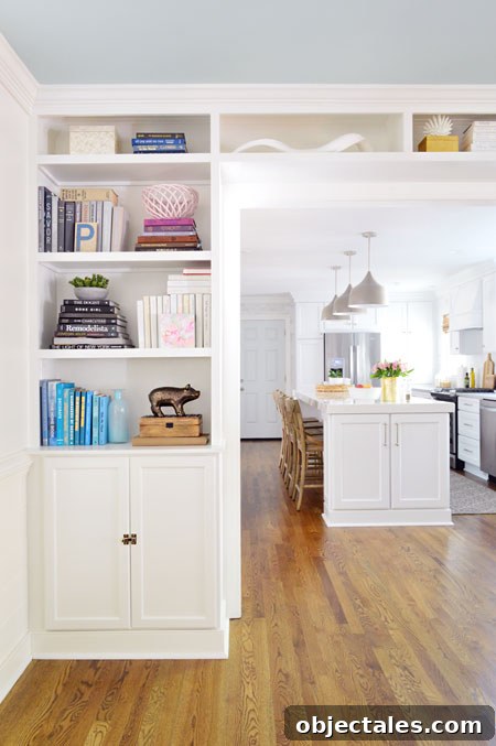 Build Custom Built-In Bookshelves: A Step-by-Step Guide 22 built-in bookshelves in opening to kitchen