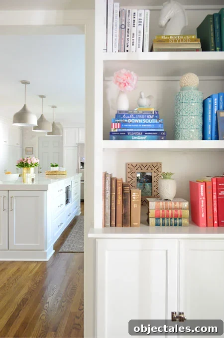 Build Custom Built-In Bookshelves: A Step-by-Step Guide 23 white built-in bookshelves with kitchen in background
