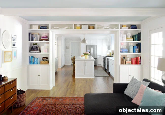 Build Custom Built-In Bookshelves: A Step-by-Step Guide 25 white built-in bookshelves around doorway between living room and kitchen