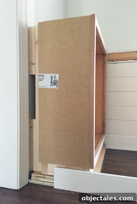 Build Custom Built-In Bookshelves: A Step-by-Step Guide 10 Blocking behind base cabinet for built-in bookshelf