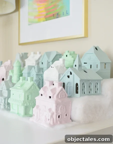 miniature Christmas village set in pastel colors