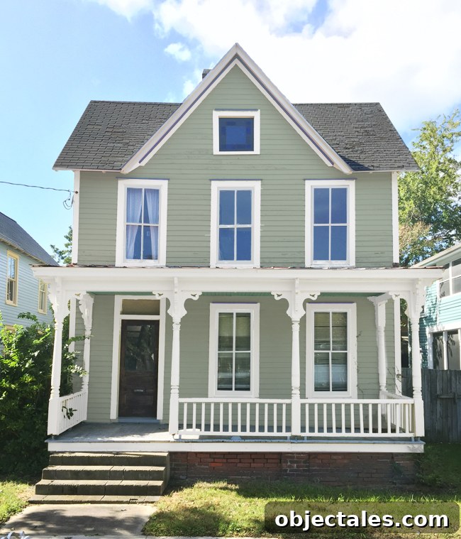 Existing green-gray siding with creamy trim