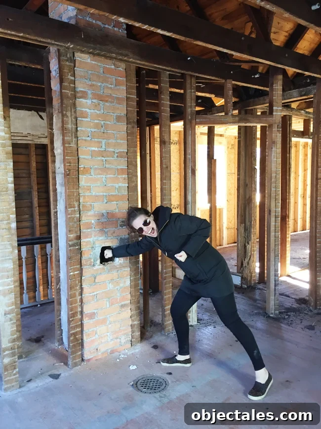 Beach House Gut Renovation: Stripping It Down to the Studs 6 Exposed brick chimney discovery
