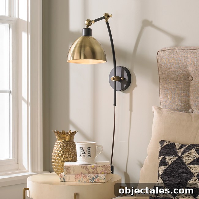 Adjustable arm wall sconce in staged room