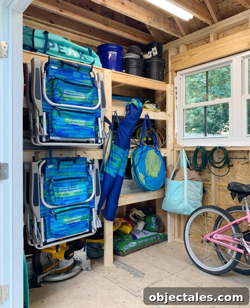 Beach gear hanging on large rubber hooks on the front of heavy duty storage shelves