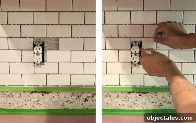 John placing cut subway tile around outlet on kitchen backsplash