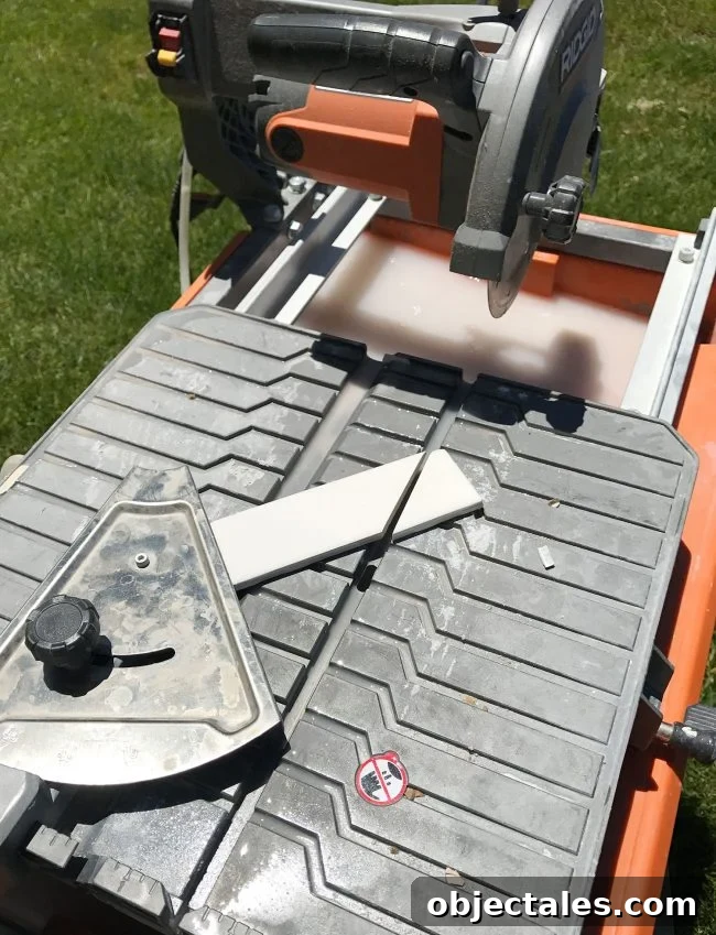 wet saw being used to cut a 45 degree angle on single subway tile