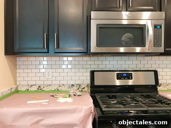kitchen backsplash with subway tile hung but not grouted