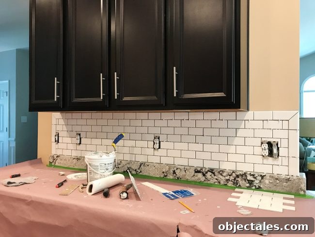 ungrouted white subway tile backsplash with bullnose edges