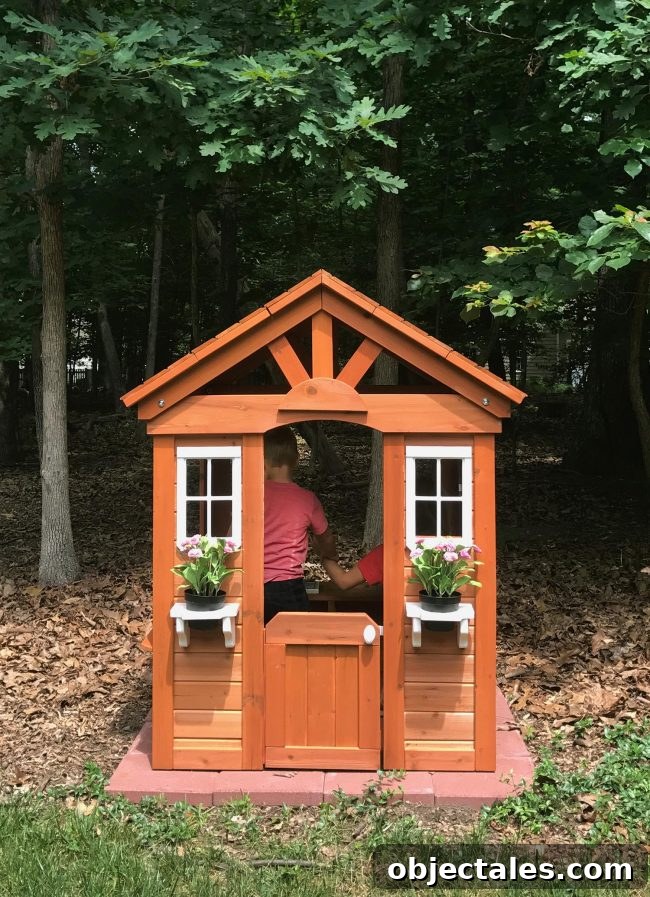 backyard discoveries cedar wooden playhouse kids playing inside